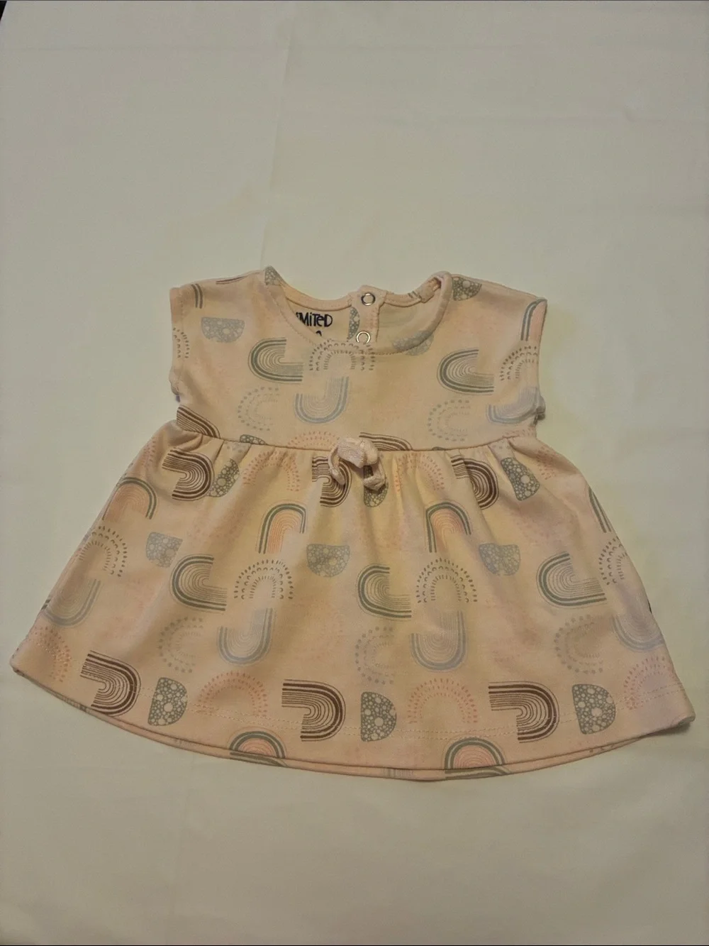 The Limited Pastel Rainbow Print Baby Dress in Pink